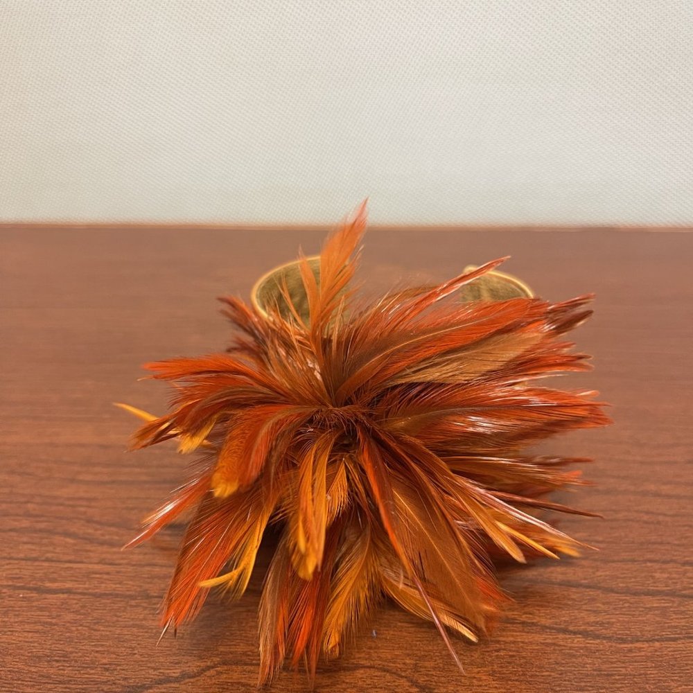 Funky Tasha orange cuff statement bracelet with orange feathers